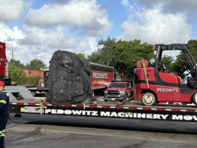 Who do you call to lift 2 heavy motors into place in South Florida?